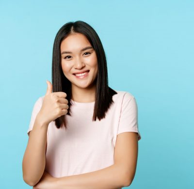beautiful-smiling-asian-girl-showing-thumb-up-approve-smth-good-agree-recommending-company-brand-sta-scaled.jpg