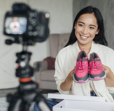 woman-vlogging-with-her-sports-shoes-scaled.jpg